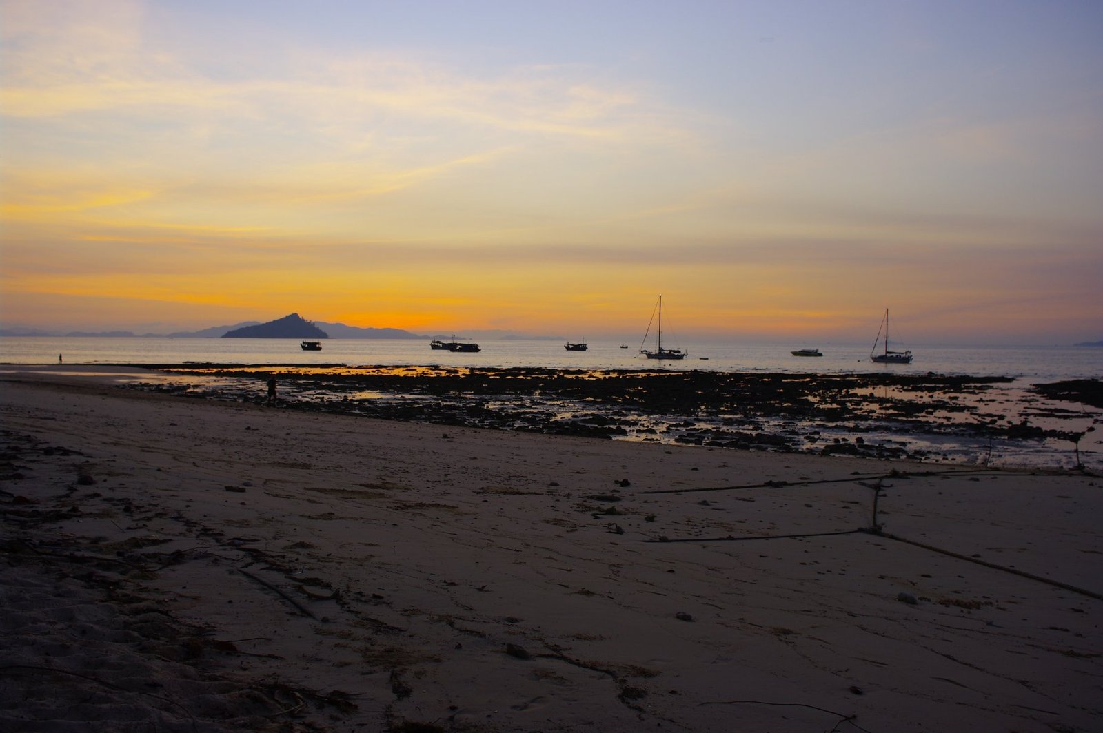 Evening shoreline and boats under the sky at Koh Bulon-Lae